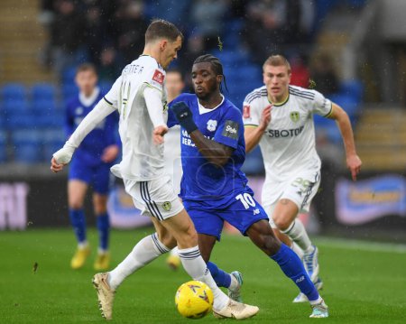 Photo for Sheyi Ojo #10 of Cardiff City knocks the ball around Diego Llorente #14 of Leeds United during the Emirates FA Cup Third Round match Cardiff City vs Leeds United at Cardiff City Stadium, Cardiff, United Kingdom, 8th January 202 - Royalty Free Image