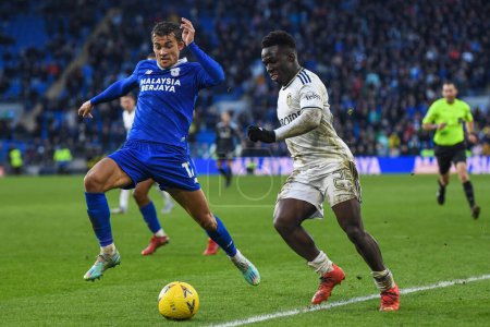 Photo for Wilfried Gnonto #29 of Leeds United under pressure from Tom Sang #12 of Cardiff City  during the Emirates FA Cup Third Round match Cardiff City vs Leeds United at Cardiff City Stadium, Cardiff, United Kingdom, 8th January 202 - Royalty Free Image