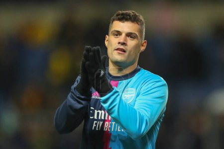 Foto de Granit Xhaka #34 of Arsenal applauds the fans during the pre-game warm up ahead of the Emirates FA Cup Third Round match Oxford United vs Arsenal at Kassam Stadium, Oxford, United Kingdom, 9th January 202 - Imagen libre de derechos