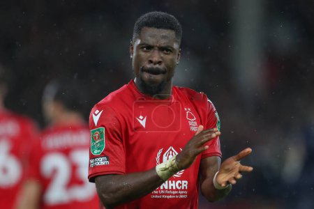 Photo for Serge Aurier #24 of Nottingham Forest applauds the home fans after the Carabao Cup Quarter Final match Nottingham Forest vs Wolverhampton Wanderers at City Ground, Nottingham, United Kingdom, 11th January 202 - Royalty Free Image