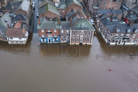 Photo for Business are flooded out as heavy rain causes the River Ouse in York burst its banks flooding buildings in York City Centre, York, United Kingdom, 12th January 202 - Royalty Free Image