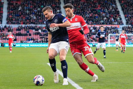Téléchargez les photos : Matt Crooks #25 of Middlesbrough and Shaun Hutchinson #4 of Millwall battle for the ball during the Sky Bet Championship match Middlesbrough vs Millwall at Riverside Stadium, Middlesbrough, United Kingdom, 14th January 202 - en image libre de droit