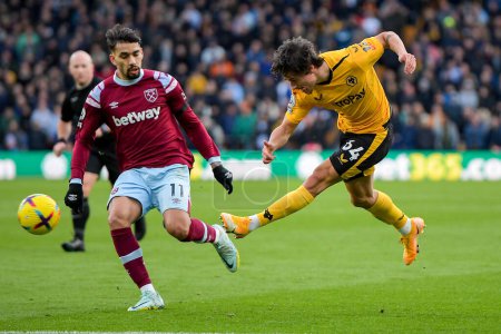 Photo for Hugo Bueno #64 of Wolverhampton Wanderers has a shot during the Premier League match Wolverhampton Wanderers vs West Ham United at Molineux, Wolverhampton, United Kingdom, 14th January 202 - Royalty Free Image
