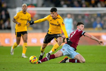 Photo for Matheus Nunes #27 of Wolverhampton Wanderers challenges Declan Rice #41 of West Ham United during the Premier League match Wolverhampton Wanderers vs West Ham United at Molineux, Wolverhampton, United Kingdom, 14th January 202 - Royalty Free Image