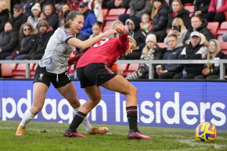 Téléchargez les photos : Alessia Russo #23 of Manchester United shields the ball from  Leighanne Robe #3 of Liverpool Women chase the ball during the The Fa Women's Super League match Manchester United Women vs Liverpool Women at Leigh Sports Village, Leigh, United Kingdom, - en image libre de droit