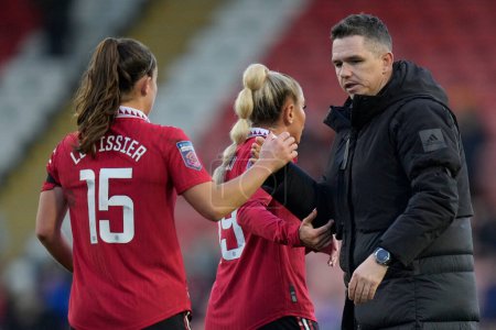 Photo for Marc Skinner the Manchester United Women's manager congratulates Maya Le Tissier #15 of Manchester United after the The Fa Women's Super League match Manchester United Women vs Liverpool Women at Leigh Sports Village, Leigh, United Kingdom, 15th Janu - Royalty Free Image