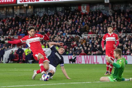 Foto de Shaun Hutchinson #4 of Millwall puts in a last ditch challenge on Matt Crooks #25 of Middlesbrough during the Sky Bet Championship match Middlesbrough vs Millwall at Riverside Stadium, Middlesbrough, United Kingdom, 14th January 202 - Imagen libre de derechos
