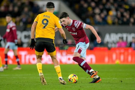 Photo for Declan Rice #41 of West Ham United takes on Raul Jimenez #9 of Wolverhampton Wanderers during the Premier League match Wolverhampton Wanderers vs West Ham United at Molineux, Wolverhampton, United Kingdom, 14th January 202 - Royalty Free Image
