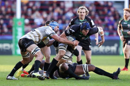 Photo for Josh Basham of London Irish is tackled during the European Champions Cup match London Irish vs Stormers at the Gtech Community Stadium, Brentford, United Kingdom, 15th January 202 - Royalty Free Image