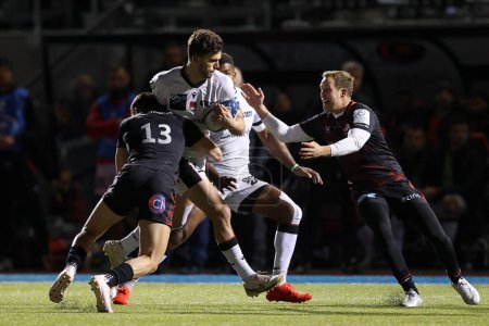 Photo for Ethan Durmoriter of Lyon Rugby is tackled by Alex Lozowski of Saracens during the European Champions Cup match Saracens vs Lyon at StoneX Stadium, London, United Kingdom, 14th January 202 - Royalty Free Image