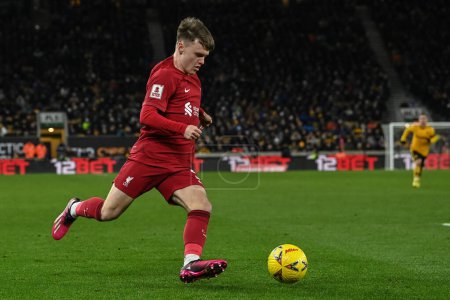Photo for Ben Doak #50 of Liverpool crosses the ball during the Emirates FA Cup Third Round Replay match Wolverhampton Wanderers vs Liverpool at Molineux, Wolverhampton, United Kingdom, 17th January 202 - Royalty Free Image