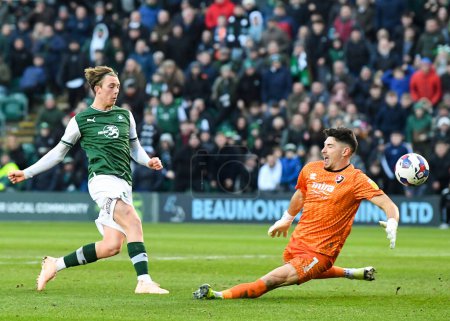 Photo for GOAL Plymouth Argyle midfielder Callum Wright (26)  shoots and scores a goal to make it 3-1  during the Sky Bet League 1 match Plymouth Argyle vs Cheltenham Town at Home Park, Plymouth, United Kingdom, 21st January 202 - Royalty Free Image