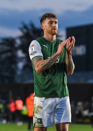 Photo for Plymouth Argyle defender Dan Scarr  (6) applauds the fans at full time  during the Sky Bet League 1 match Plymouth Argyle vs Cheltenham Town at Home Park, Plymouth, United Kingdom, 21st January 202 - Royalty Free Image