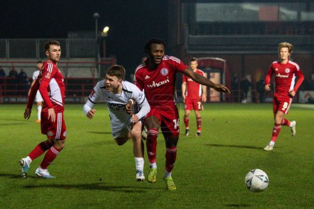 Foto de Zak Brunt #20 of Boreham Wood is fouled by Rosaire Longelo #14 of Accrington Stanley during the Emirates FA Cup Third Round Replay match Accrington Stanley vs Boreham Wood at Wham Stadium, Accrington, United Kingdom, 24th January 202 - Imagen libre de derechos