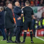 Erik ten Hag manager of Manchester United laughs with the linesman after Marcus Rashford #10 of Manchester United scores a goal to make it 0-1 during the Carabao Cup Semi-Finals match Nottingham Forest vs Manchester United at City Ground, Nottingham,