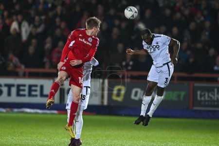 Photo for Will Evans #5 of Boreham Wood heads clear during the Emirates FA Cup Third Round Replay match Accrington Stanley vs Boreham Wood at Wham Stadium, Accrington, United Kingdom, 24th January 202 - Royalty Free Image