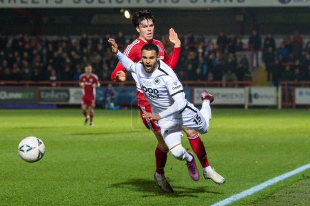 Foto de Dennon Lewis #15 of Boreham Wood is fouled by Doug Tharme #34 of Accrington Stanley during the Emirates FA Cup Third Round Replay match Accrington Stanley vs Boreham Wood at Wham Stadium, Accrington, United Kingdom, 24th January 202 - Imagen libre de derechos