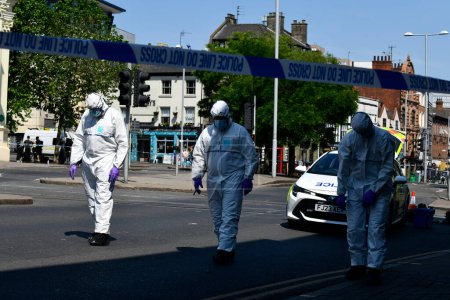Photo for Forensic police officers search the local area. Nottingham van attack: Three people dead and a man arrested after 'major incident' at Nottingham City,  Nottingham, United Kingdom, 13th June 2023 - Royalty Free Image