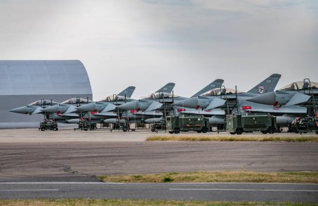 Photo for Eurofighter Typhoons prepare for the Tropping the colour flypast as the Battle of Britain memorial flight and RAF Coningsby typhoon squadrons prepare for the flypast for Trooping the colour at RAF Coningsby, Coningsby, United Kingdom, 17th June 2023 - Royalty Free Image