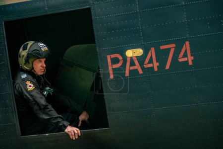 Photo for Chief Technician Tim Davies waits on the Lancaster as the Battle of Britain memorial flight and RAF Coningsby typhoon squadrons prepare for the flypast for Trooping the colour at RAF Coningsby, Coningsby, United Kingdom, 17th June 2023 - Royalty Free Image