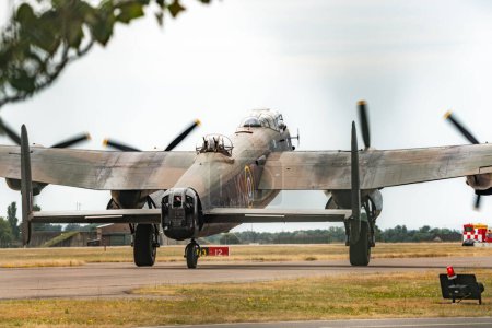 Photo for The Lancaster departs RAF Coningsby as the Battle of Britain memorial flight and RAF Coningsby typhoon squadrons prepare for the flypast for Trooping the colour at RAF Coningsby, Coningsby, United Kingdom, 17th June 2023 - Royalty Free Image