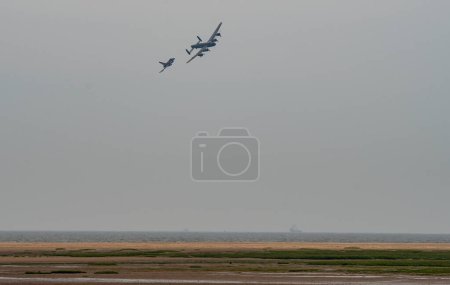 Photo for Lancaster of the Battle of Britain Memorial Flight and Typhoon Display Team display at Cleethorpes Armed Forces Day at Cleethorpes sea front, Cleethorpes, United Kingdom, 18th June 2023 - Royalty Free Image
