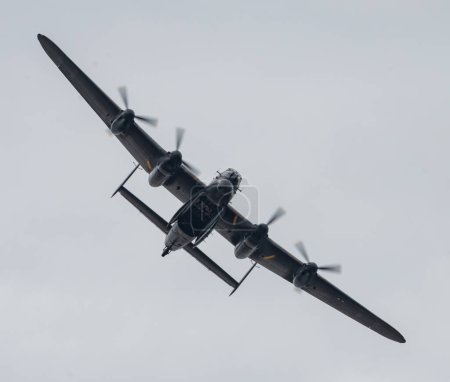 Photo for The Battle of Britain Memorial Flights Lancaster bomber PA474 performs a bomb bay door open pass during its display, during Rhyl Air Show 2023 at Rhyl Seafront, Rhyl, United Kingdom, 27th August 2023 - Royalty Free Image