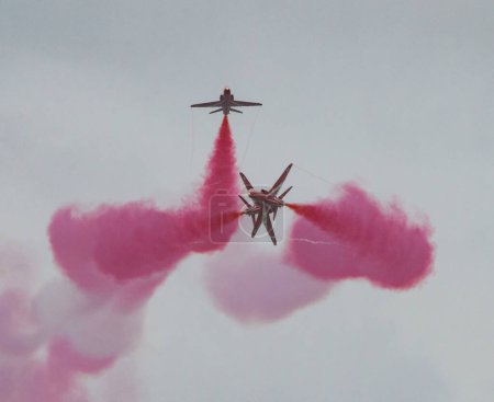 Photo for Royal Air Force Aerobatic Team The Red Arrows Hanna formation performs a synchronised cross over, during Rhyl Air Show 2023 at Rhyl Seafront, Rhyl, United Kingdom, 27th August 2023 - Royalty Free Image