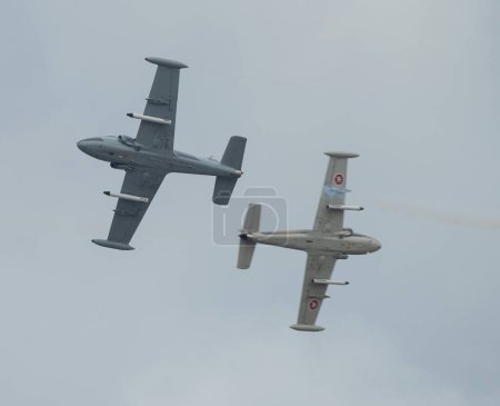 Photo for Strikemaster pair perform a cross over pass during their display, Rhyl Air Show 2023 at Rhyl Seafront, Rhyl, United Kingdom, 27th August 2023 - Royalty Free Image