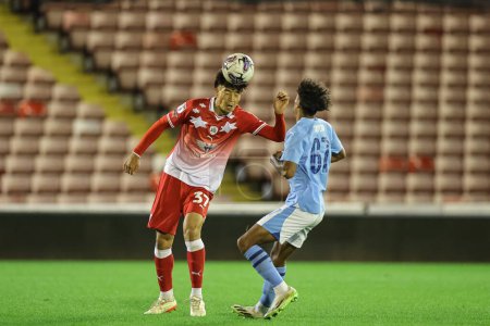 Photo for Nathan James #37 of Barnsley wins the header during the EFL Trophy match Barnsley vs Manchester City U21 at Oakwell, Barnsley, United Kingdom, 26th September 2023 - Royalty Free Image