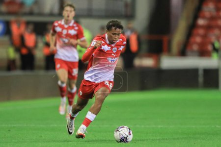 Photo for Theo Chapman #38 of Barnsley breaks with the ball during the EFL Trophy match Barnsley vs Manchester City U21 at Oakwell, Barnsley, United Kingdom, 26th September 2023 - Royalty Free Image