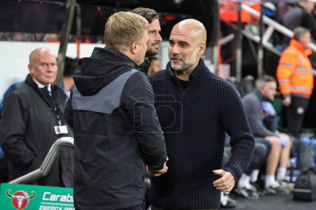 Photo for Pep Guardiola manager of Manchester City and Eddie Howe manager of Newcastle United shake hands before the game during the Carabao Cup Third Round match Newcastle United vs Manchester City at St. James's Park, Newcastle, United Kingdom, 27th Septembe - Royalty Free Image