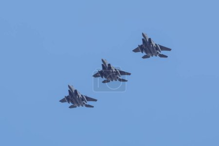 Photo for A trio of McDonnell Douglas F-15 Eagle in a close flying formation at RAF Lakenheath, Lakenheath, United Kingdom, 3rd October 202 - Royalty Free Image