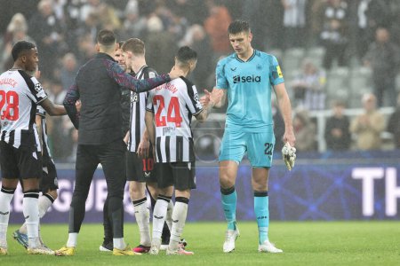 Photo for Miguel Almirn #24 of Newcastle United embraces Nick Pope #22 of Newcastle United after Newcastle lose 0-1 during the UEFA Champions League match Newcastle United vs Borussia Dortmund at St. James's Park, Newcastle, United Kingdom, 25th October 2023 - Royalty Free Image