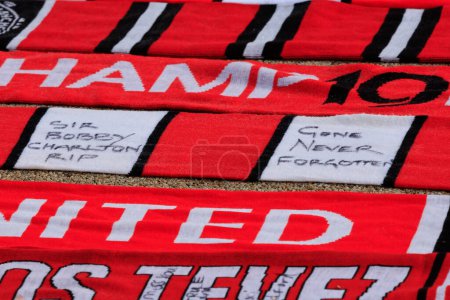 Photo for Scarves laid out in tribute to the late Sir Bobby Charlton outside of Old Trafford, Manchester, United Kingdom, 23rd October 2023 - Royalty Free Image