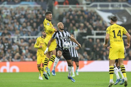 Photo for Joelinton #7 of Newcastle United wins the ball during the UEFA Champions League match Newcastle United vs Borussia Dortmund at St. James's Park, Newcastle, United Kingdom, 25th October 2023 - Royalty Free Image