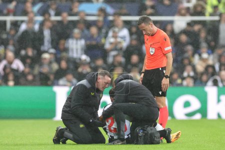Photo for Jacob Murphy #23 of Newcastle United receives treatment during the UEFA Champions League match Newcastle United vs Borussia Dortmund at St. James's Park, Newcastle, United Kingdom, 25th October 2023 - Royalty Free Image