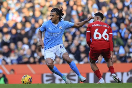 Photo for Nathan Ake #6 of Manchester City escapes from Trent Alexander-Arnold #66 of Liverpool during the Premier League match Manchester City vs Liverpool at Etihad Stadium, Manchester, United Kingdom, 25th November 2023 - Royalty Free Image