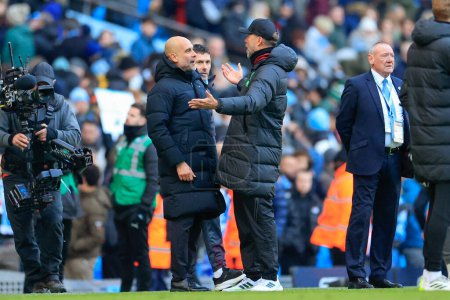 Photo for Pep Guardiola the Manchester City manager and Liverpool manager Jurgen Klopp at the end of the Premier League match Manchester City vs Liverpool at Etihad Stadium, Manchester, United Kingdom, 25th November 2023 - Royalty Free Image