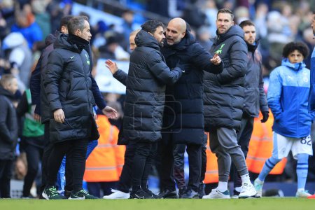 Photo for Pep Guardiola the Manchester City manager remonstrates with one of the Liverpool staff at the end of the Premier League match Manchester City vs Liverpool at Etihad Stadium, Manchester, United Kingdom, 25th November 2023 - Royalty Free Image