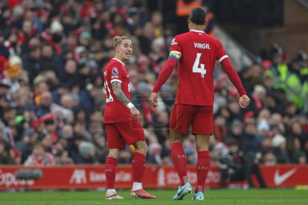Photo for Kostas Tsimikas #21 of Liverpool gives Virgil van Dijk #4 of Liverpool instructions during the Premier League match Liverpool vs Fulham at Anfield, Liverpool, United Kingdom, 3rd December 2023 - Royalty Free Image