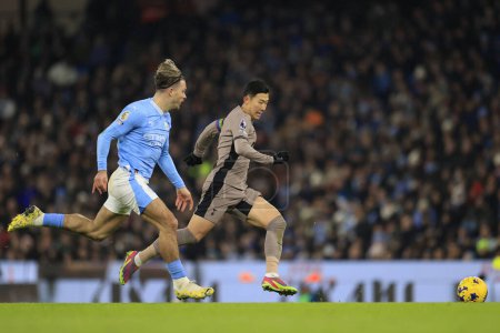 Photo for Son Heung-Min #7 of Tottenham Hotspur is chased by Jack Grealish #10 of Manchester City during the Premier League match Manchester City vs Tottenham Hotspur at Etihad Stadium, Manchester, United Kingdom, 3rd December 2023 - Royalty Free Image
