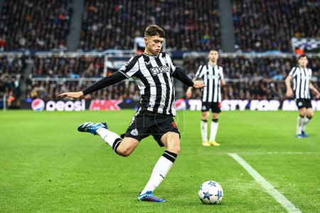 Photo for Lewis Miley #67 of Newcastle United crosses the ball across the box during the UEFA Champions League match Newcastle United vs AC Milan at St. James's Park, Newcastle, United Kingdom, 13th December 2023 - Royalty Free Image