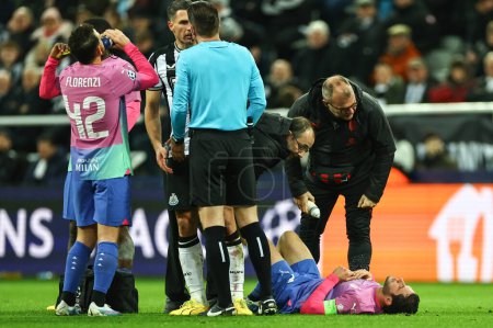 Photo for Davide Calabria #2 of AC Milan receives treatment during the UEFA Champions League match Newcastle United vs AC Milan at St. James's Park, Newcastle, United Kingdom, 13th December 2023 - Royalty Free Image