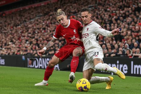 Photo for Antony of Manchester United clears the ball from Kostas Tsimikas of Liverpool in the defensive area during the Premier League match Liverpool vs Manchester United at Anfield, Liverpool, United Kingdom, 17th December 202 - Royalty Free Image