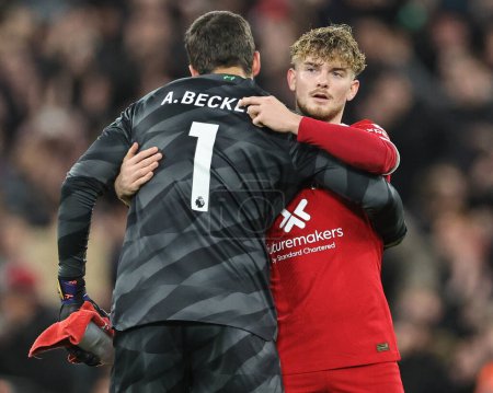 Photo for Alisson Becker of Liverpool embraces Harvey Elliott of Liverpool during the Premier League match Liverpool vs Manchester United at Anfield, Liverpool, United Kingdom, 17th December 202 - Royalty Free Image