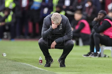 Photo for David Moyes manager of West Ham United rects after Manchester United win a free kick during the Premier League match West Ham United vs Manchester United at London Stadium, London, United Kingdom, 23rd December 202 - Royalty Free Image