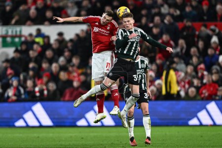 Photo for Scott McTominay of Manchester United and Chris Wood of Nottingham Forest battle for the ball during the Premier League match Nottingham Forest vs Manchester United at City Ground, Nottingham, United Kingdom, 30th December 202 - Royalty Free Image