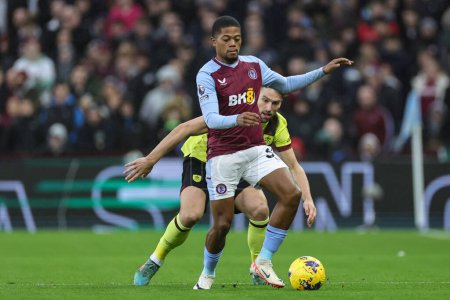 Photo for Leon Bailey of Aston Villa holds the ball as Charlie Taylor of Burnley pressures during the Premier League match Aston Villa vs Burnley at Villa Park, Birmingham, United Kingdom, 30th December 202 - Royalty Free Image