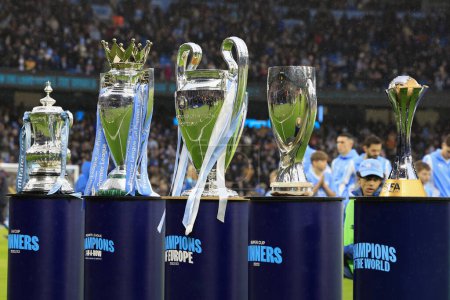 Photo for Citys five trophies provide the backdrop ahead of the Premier League match Manchester City vs Sheffield United at Etihad Stadium, Manchester, United Kingdom, 30th December 2023 - Royalty Free Image
